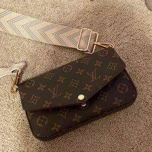Louis Vuitton purse with an extra wallet inside and a extra strap.